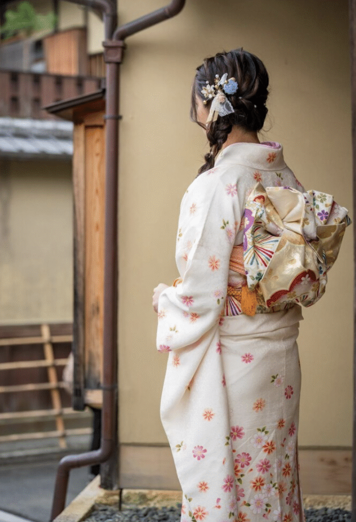 A female is wearing Traditional Japanese clothes KIMONO